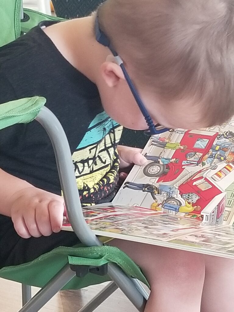 boy reading timberdoodle board book